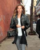 Gisele Bundchen in black leather jacket