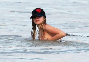Avril Lavigne nip slip at the beach in Malibu