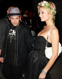 Paris Hilton shows cleavage an legs in small black dress partying at Tao nightclub in New York
