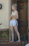 Katherine Heigl in shorts and sports bra